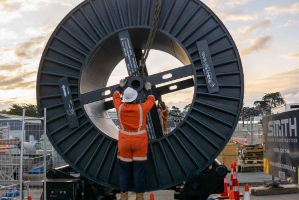 Connectics staff with a drum of the new 66kV cable